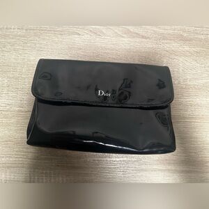 DIOR CLUTCH, MULTI-COMPARTMENT BAG WITH SIGNATURE “D” hanging from zipper pull